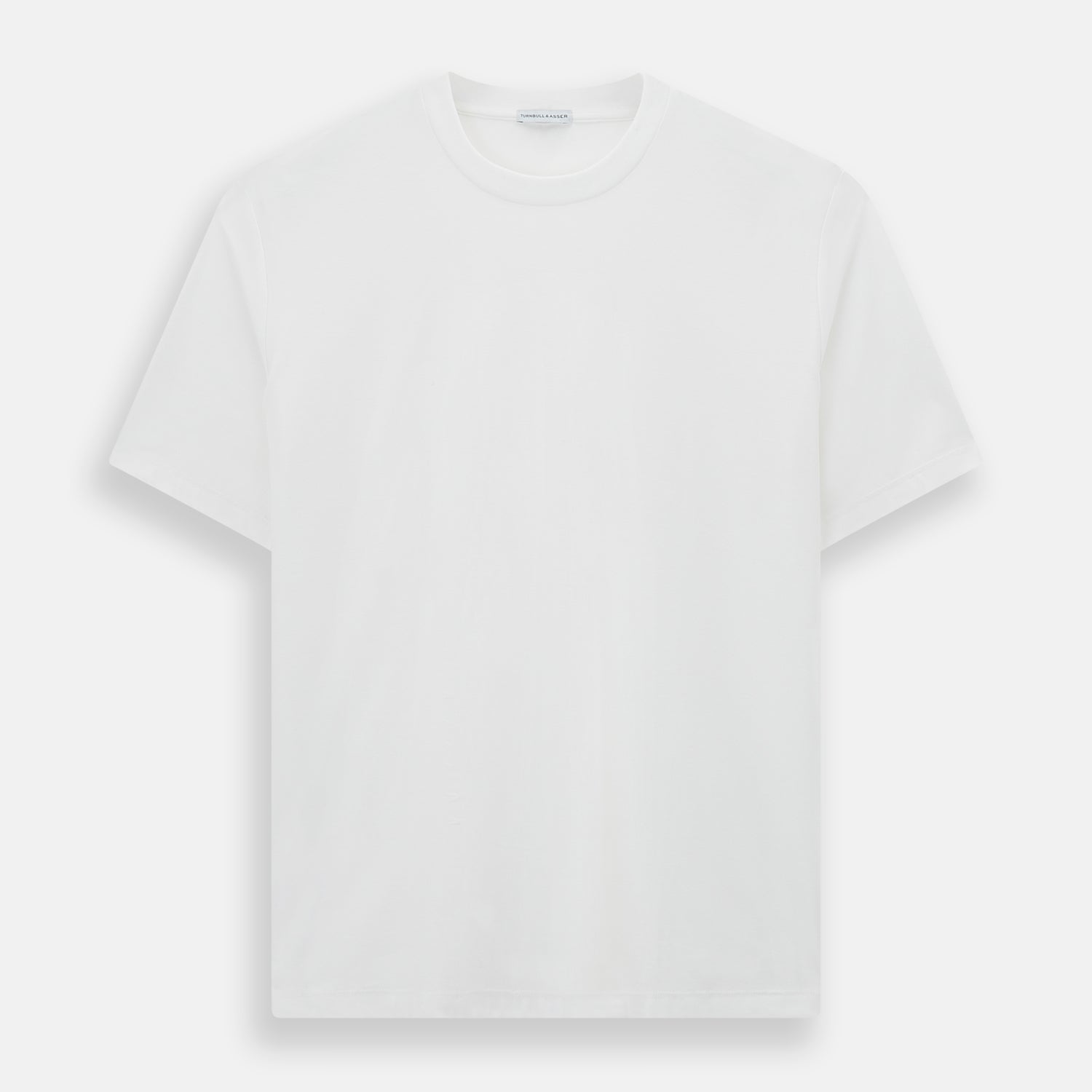The Turnbull & Asser White Short-sleeve Pyjama Shirt is shown laid flat on a white background, featuring a plain, logo-free design for effortless comfort and classic loungewear style.