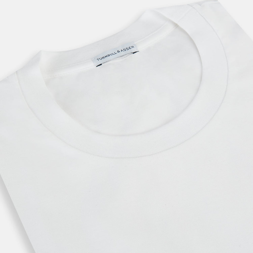 The Turnbull & Asser White Short-sleeve Pyjama Shirt is shown laid flat on a white background, featuring a plain, logo-free design for effortless comfort and classic loungewear style.