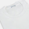 The Turnbull & Asser White Short-sleeve Pyjama Shirt is shown laid flat on a white background, featuring a plain, logo-free design for effortless comfort and classic loungewear style.