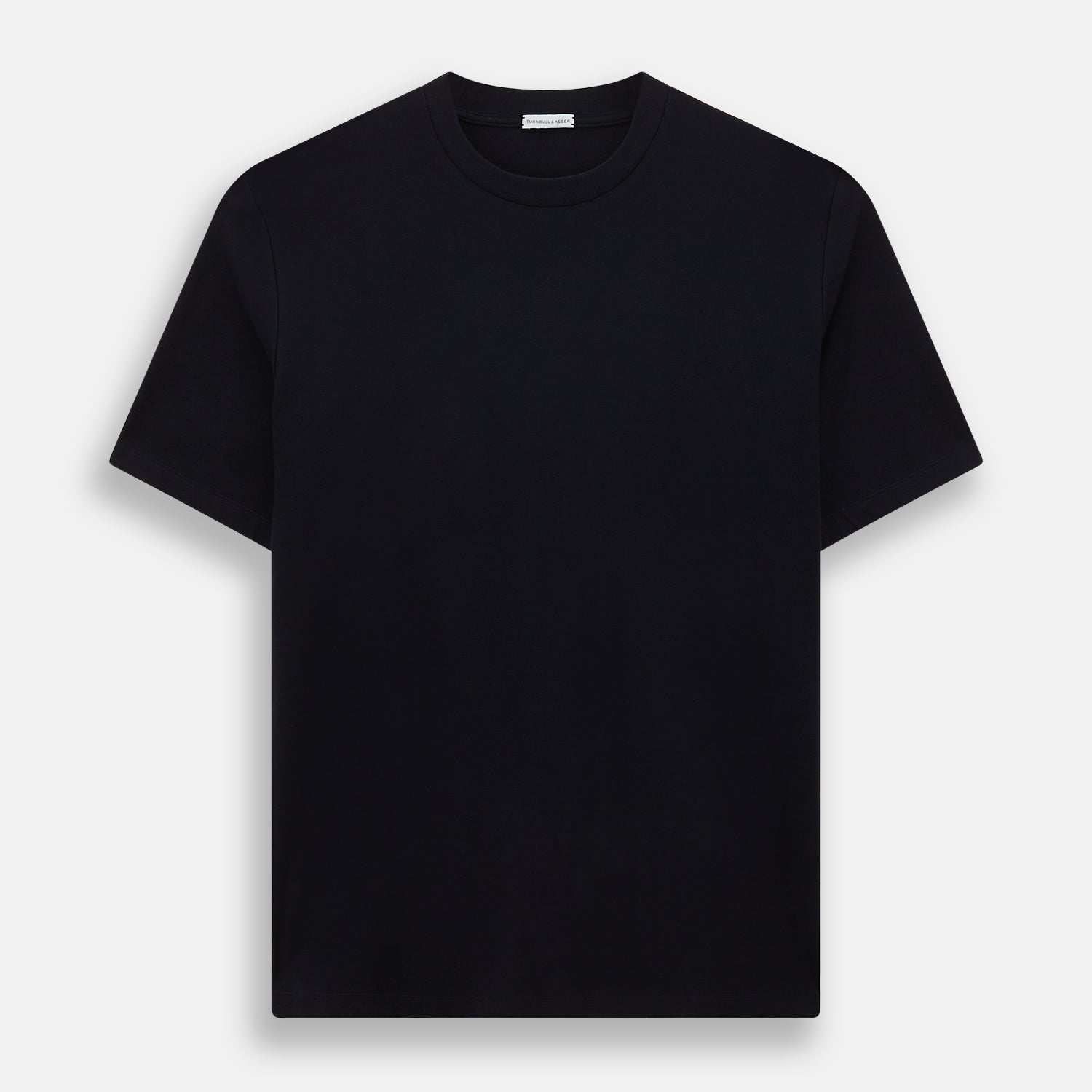 A navy short-sleeve pyjama shirt by Turnbull & Asser is laid flat on a white background, featuring a round neckline and a minimalist design—perfect for relaxed wear.