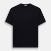 A navy short-sleeve pyjama shirt by Turnbull & Asser is laid flat on a white background, featuring a round neckline and a minimalist design—perfect for relaxed wear.
