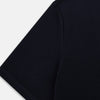 A navy short-sleeve pyjama shirt by Turnbull & Asser is laid flat on a white background, featuring a round neckline and a minimalist design—perfect for relaxed wear.